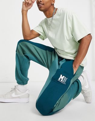 Mennace sweatpants in forest green with splicing - part of a set