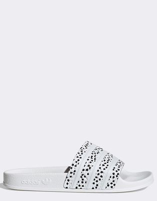 adidas Originals Adilette sliders in white with polka dot print
