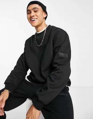 adidas Originals 'Trefoil Linear' sweatshirt in black with arm patch