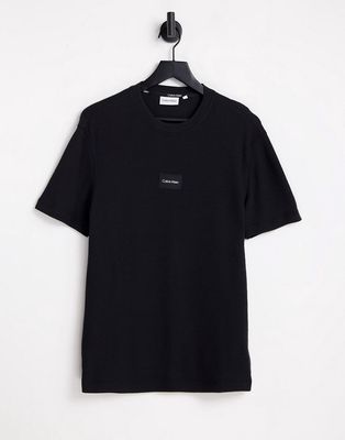 Calvin Klein textured grid logo T-shirt in black