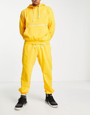 Nike Basketball Dri-FIT Standard Issue cuffed sweatpants in yellow