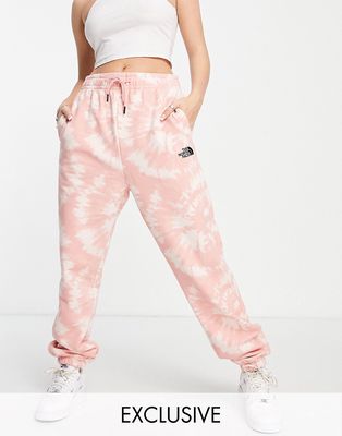 The North Face Oversized Essential sweatpants in pink tie dye Exclusive at ASOS-Neutral