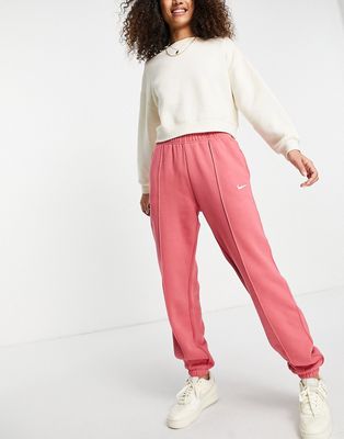 Nike Collection Fleece loose-fit cuffed sweatpants in dusty red