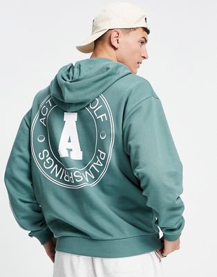ASOS Actual oversized hoodie with circular golf graphic print in teal-Green