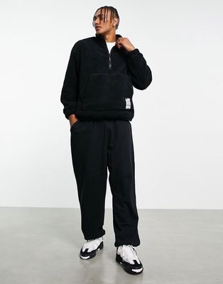 Bershka oversized half zip sweater in black teddy borg