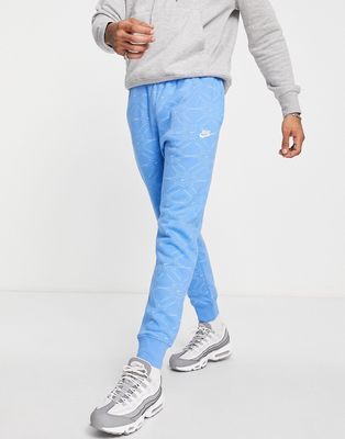 Nike Branded AOP Pack cuffed fleece sweatpants in blue-Blues