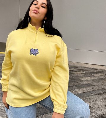 Daisy Street Plus oversized half zip sweatshirt with heart applique in pastel-Yellow
