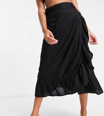Esmee Exclusive frill beach wrap skirt in black