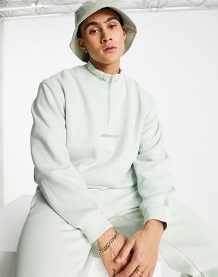 adidas Originals Trefoil Linear half zip sweatshirt in beige with arm patch-Green