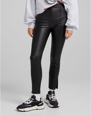 Bershka faux leather skinny pant with zip hem in black