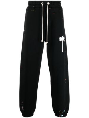 Palm Angels painted logo print track trousers - Black
