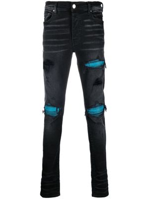 AMIRI mid-rise distressed skinny jeans - Black