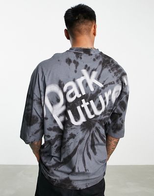 ASOS Dark Future oversized t-shirt with spiral tie dye and blurred logo graphic print in black
