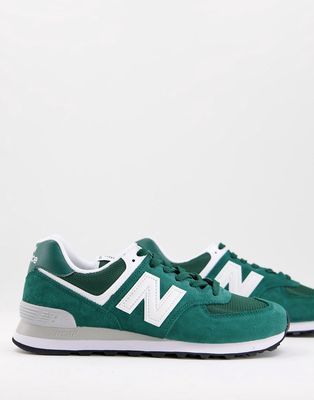 New Balance 574 sneakers in deep green and white