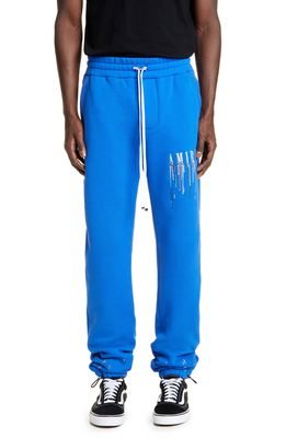 AMIRI Paint Drip Embroidered Logo Sweatpants in Blue/White