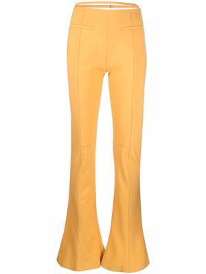 Jacquemus strapped detailing bootcut trousers - Orange