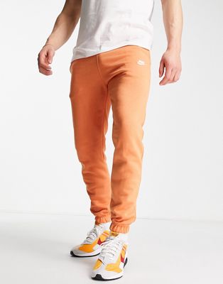 Nike Club Fleece casual fit cuffed sweatpants in dusty orange