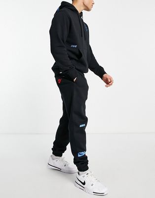 Nike Multi-Futura cuffed fleece sweatpants in black