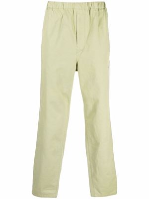 UNDERCOVER logo-patch trousers - Green