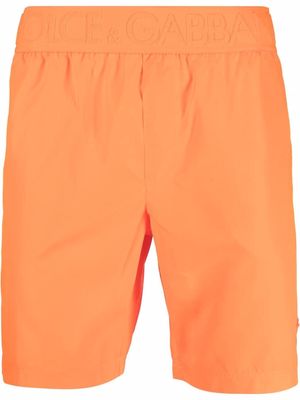 Dolce & Gabbana logo-waist swim shorts - Orange
