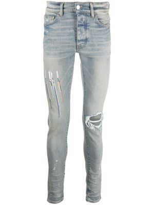 AMIRI logo-embroidered skinny jeans - Blue