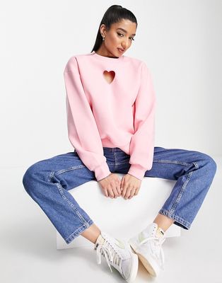 Urban Revivo sweatshirt with heart print in pink