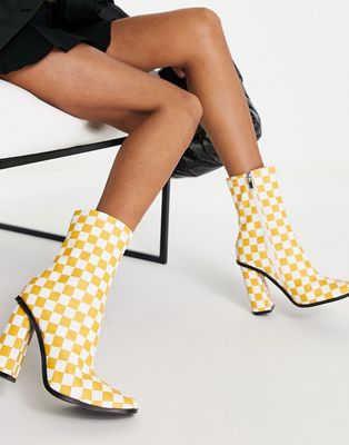 RAID Saylor block heel sock boot in orange checkerboard