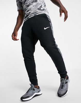 Nike Training Dri-FIT camo print cuffed sweatpants in black