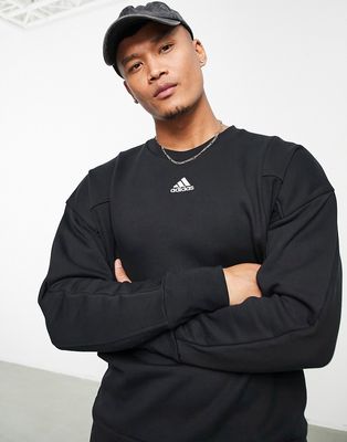 adidas Lounge embroidered logo sweatshirt in black