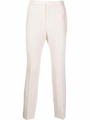 Saint Laurent slim-fit pinstripe trousers - White