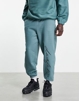 ASOS Dark Future relaxed polar fleece sweatpants in green with embroidered logo - part of a set