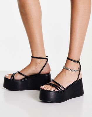 Truffle Collection extreme flatform heeled sandals in black