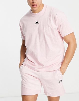 adidas Sportstyle Botantical Dye chest logo t-shirt in pink