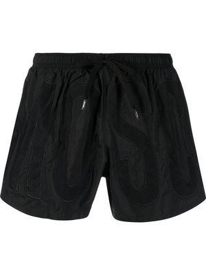 Moschino logo-embroidered swim shorts - Black