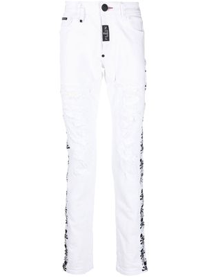 Philipp Plein distressed skull-embroidered skinny jeans - White