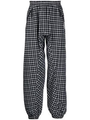 UNDERCOVER check-pattern embroidered track pants - Black