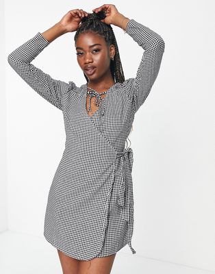 In The Style x Perrie Sian puff shoulder detail asymmetric tie side mini dress in gingham print-Multi