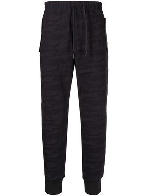Armani Exchange camouflage-jacquard tapered trousers - Black