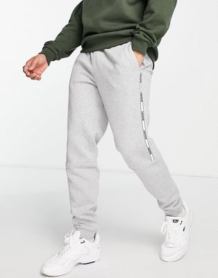Lacoste sweatpants with side taping in gray