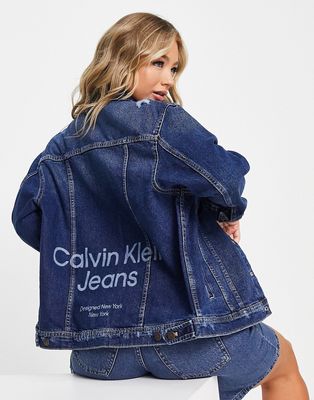 Calvin Klein Jeans monogram print denim trucker jacket in mid wash-Blue