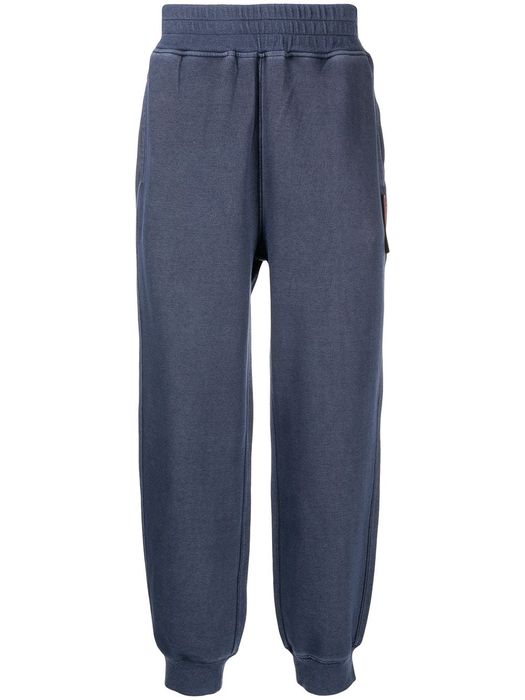 izzue garment-dyed tapered track pants - Blue