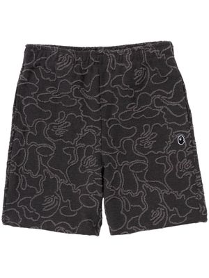 A BATHING APE® camouflage-print cotton track shorts - Black