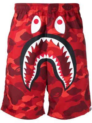 A BATHING APE® graphic shark-print deck shorts - Red