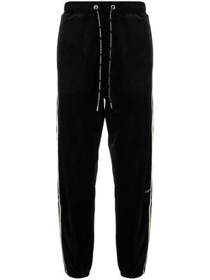 A BATHING APE® logo-embroidered cotton blend track pants - Black