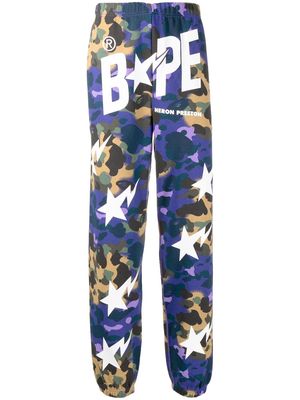 A BATHING APE® logo-print camouflage track pants - Purple