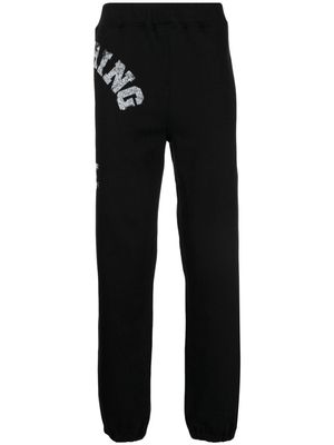 A BATHING APE® logo-print jersey track pants - Black