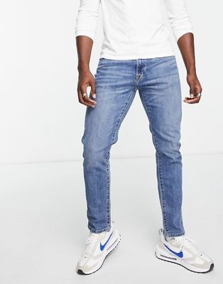 Abercrombie & Fitch Athletic skinny fit jeans in mid wash-Blue