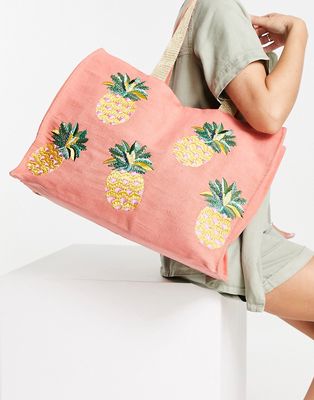 Accessorize beach bag tote with pineapple embroidered design in orange