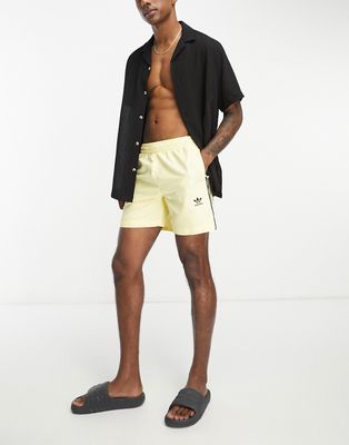 adidas Originals 3 Stripe swim shorts in yellow