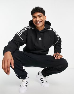 adidas Originals cut three stripe Rikeve hoodie in black